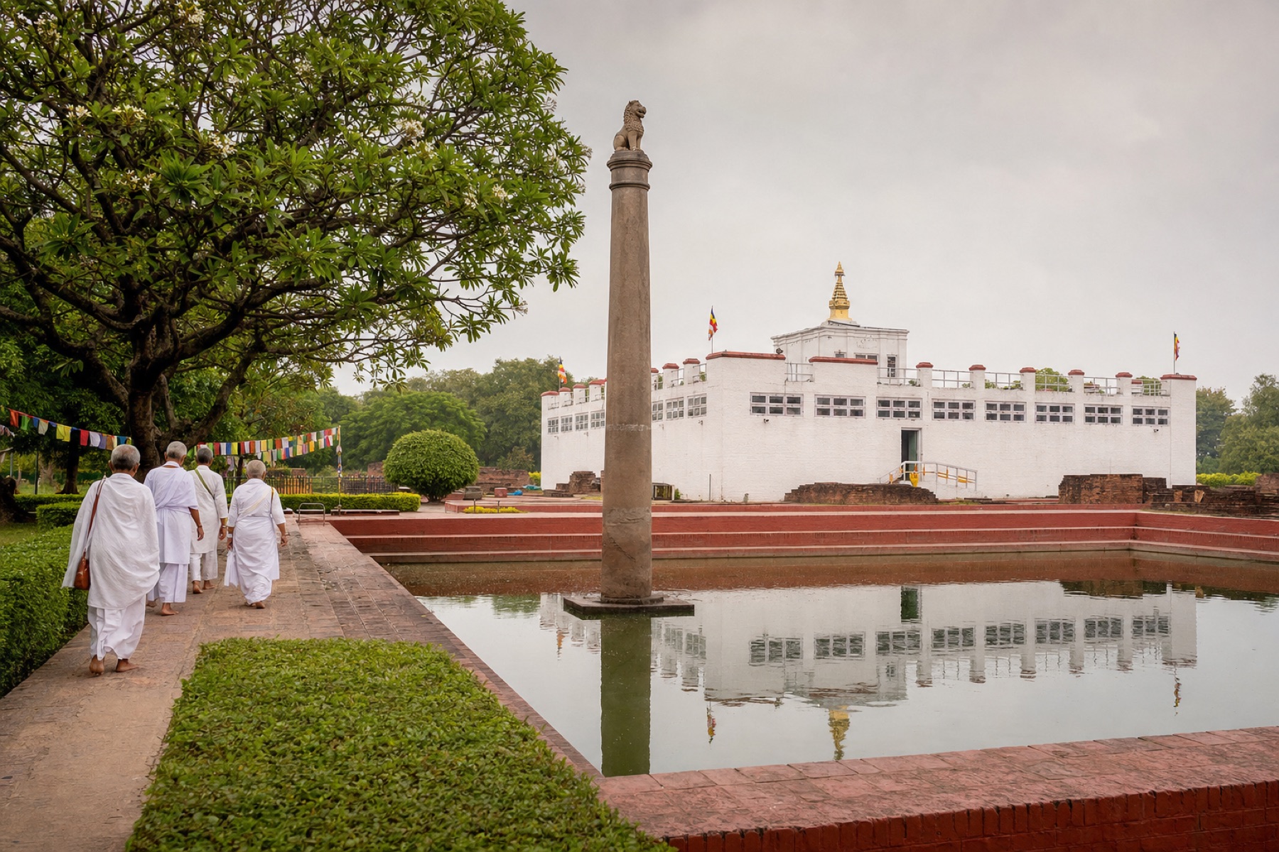 Pilgrims walking through the sacred garden at Lumbini